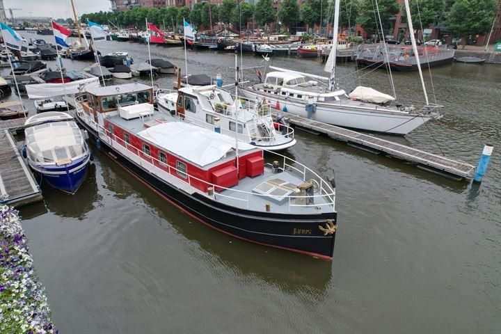 The Janus houseboat moored on an Amsterdam canal